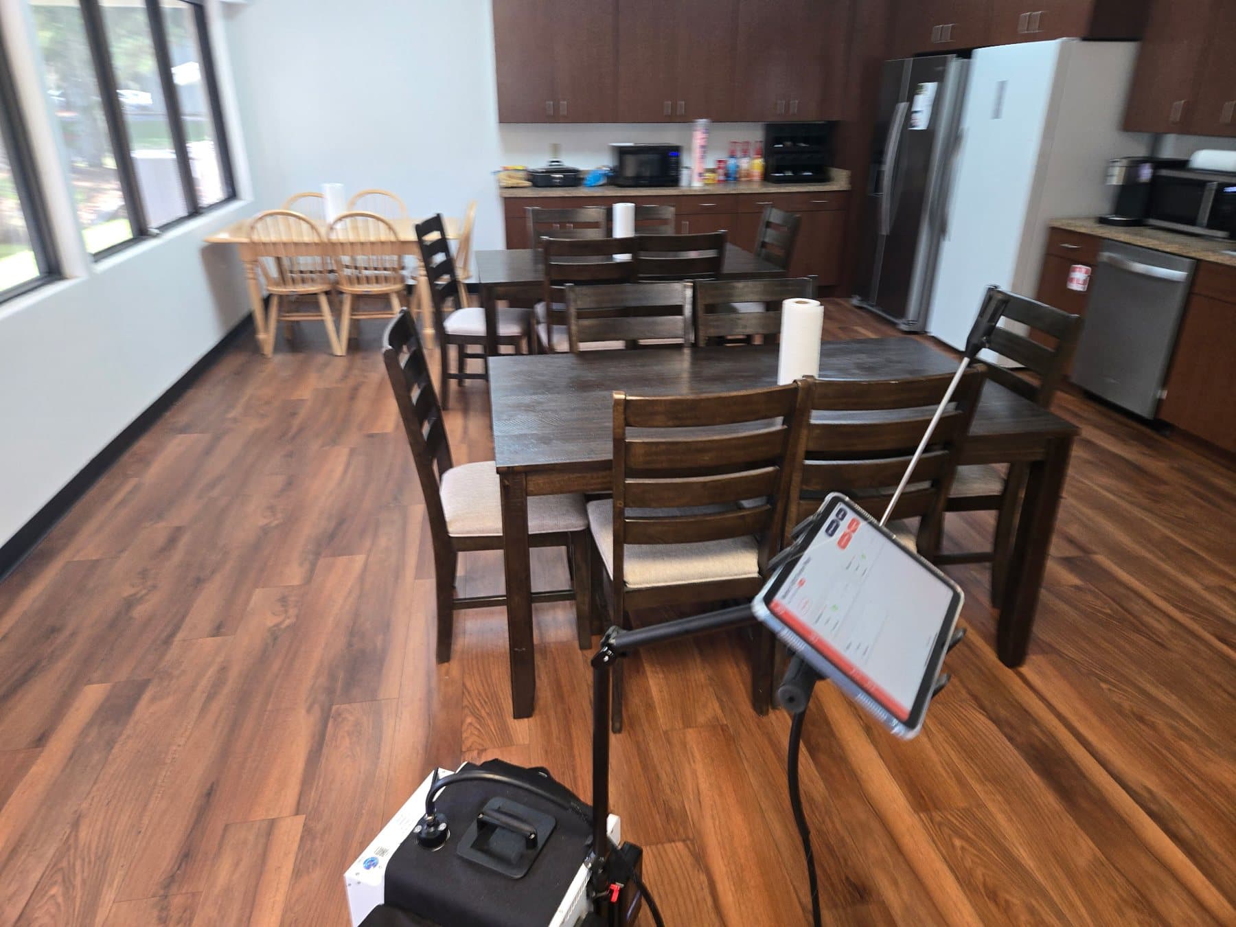 InstaScope air monitor set up in a kitchen and dining area during an indoor air quality survey