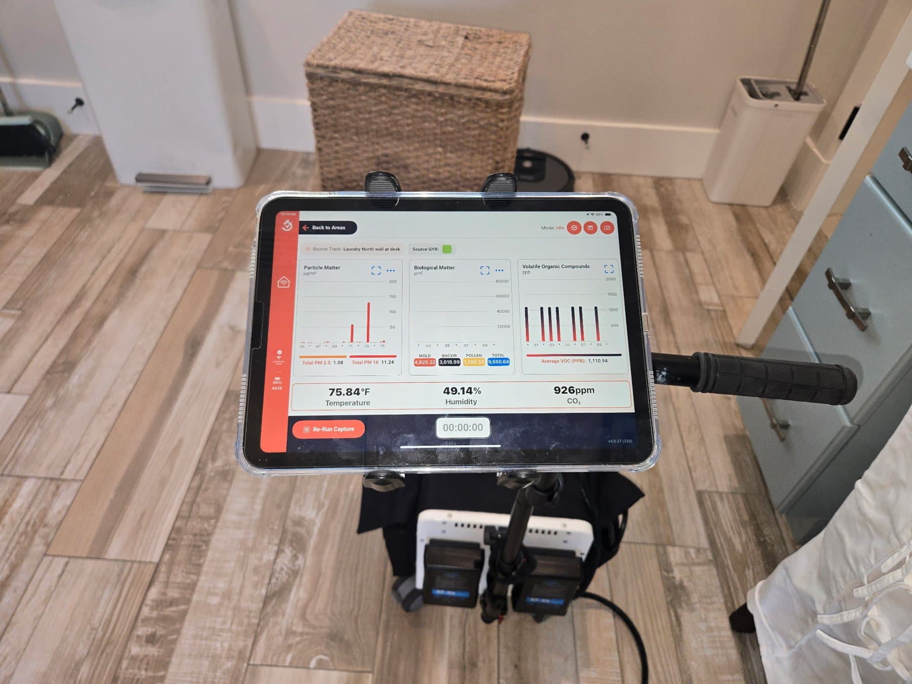 InstaScope tablet showing temperature, humidity and carbon dioxide readings inside a home